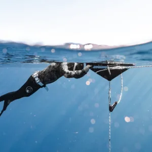 Experienced divers exploring deeper reefs near Waikiki