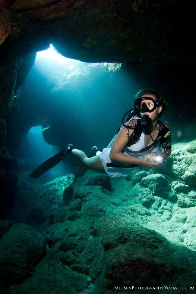 Scuba divers practicing peak performance buoyancy techniques