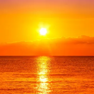 Small group sailing adventure at sunset around Oahu coastline