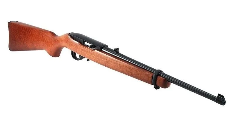 Outdoor shooting range with four guns set up for practice