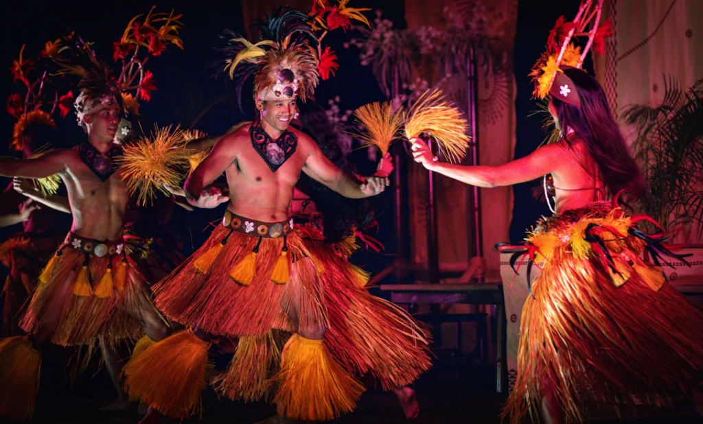Audience seated in premium area at a Hawaiian luau show