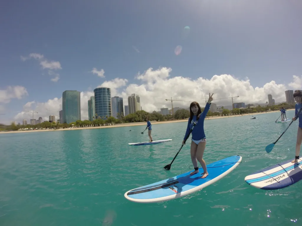Instructor teaching stand up paddleboarding at Ala Moana beach