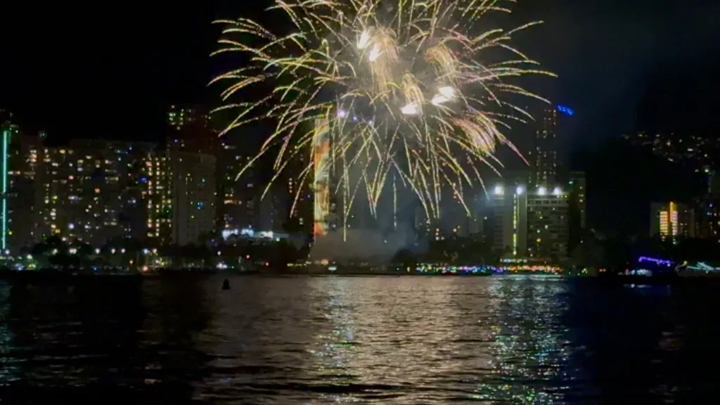 Boat cruise watching Waikiki fireworks at sunset