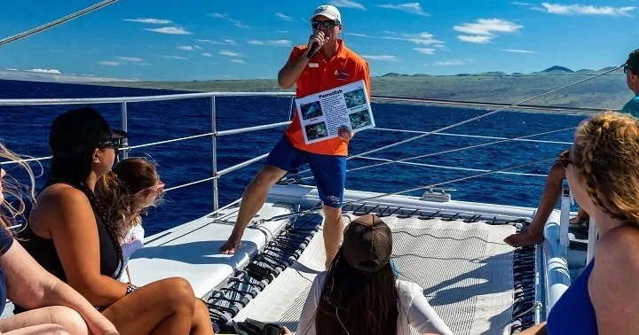 Snorkelers sailing on catamaran during Kona adventure tour