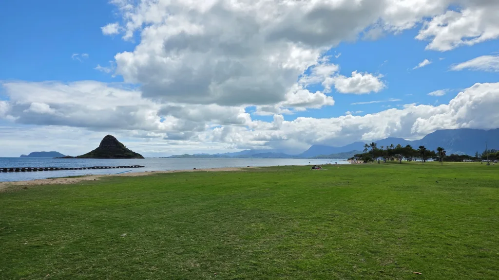 Boat cruising around island coastline
