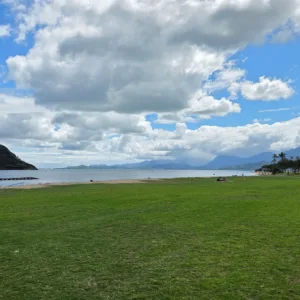 Boat cruising around island coastline