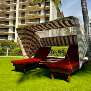 Comfortable sun bed with private cabana named Honu