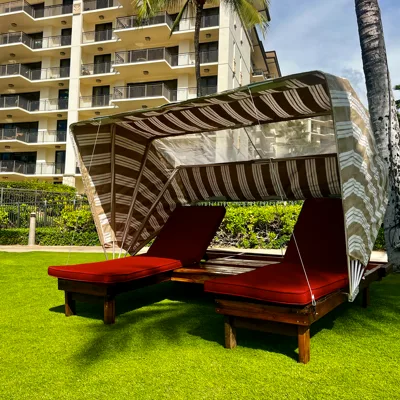 Comfortable sun bed with private cabana named Honu