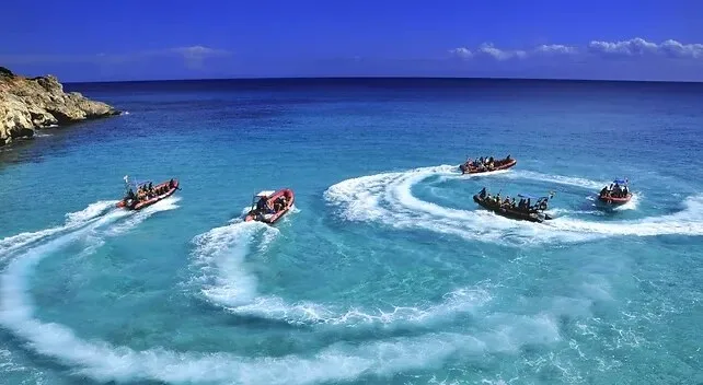 Power catamaran cruising near Kealakekua Bay coastline