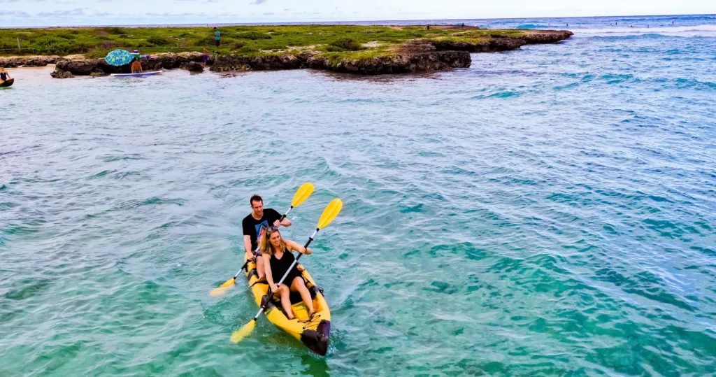 Kayakers navigating the serene waters near Popoia Island