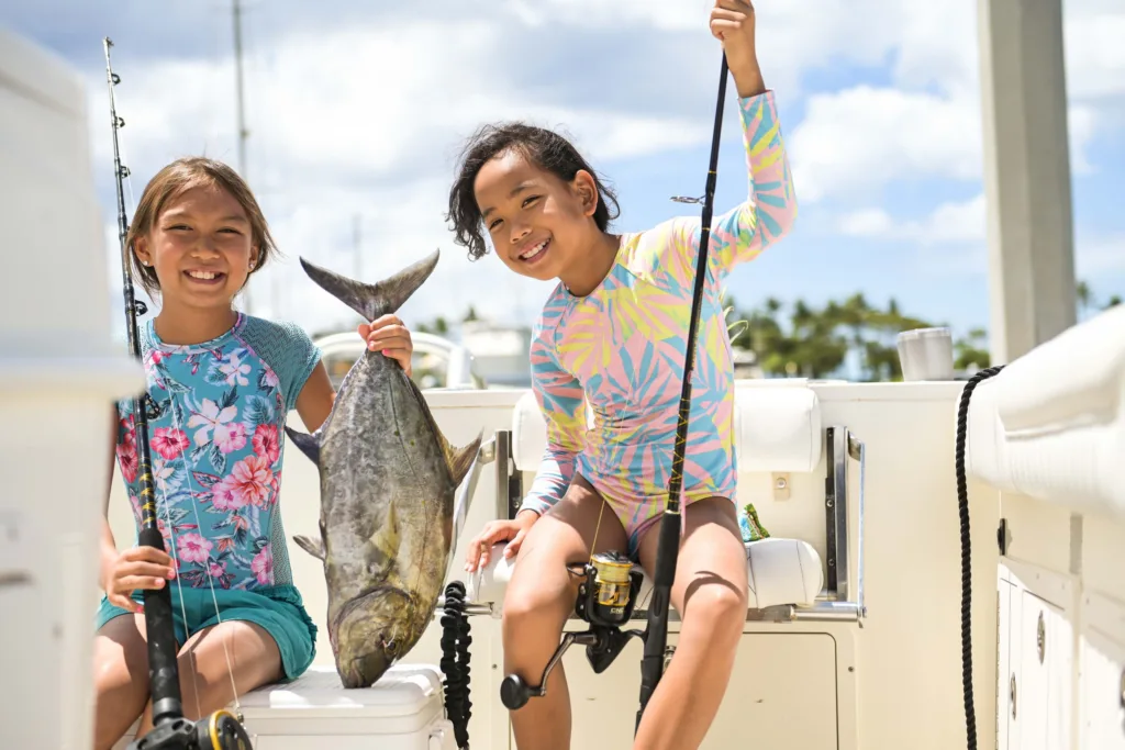 Fishing boat cruising near Ko Olina's tranquil shoreline