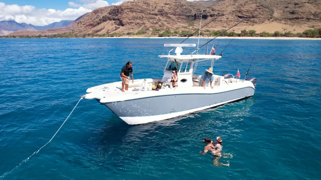 Snorkelers observing vibrant marine life near Ko Olina