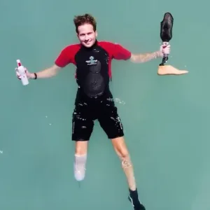 Beginners snorkeling with flotation wetsuits in calm waters