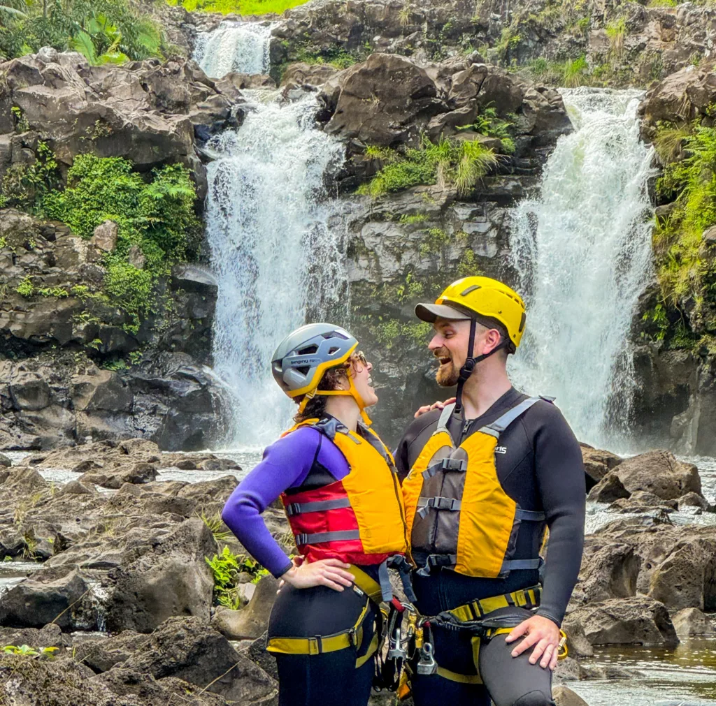 Descending the Umauma triple-tier waterfall by rappel