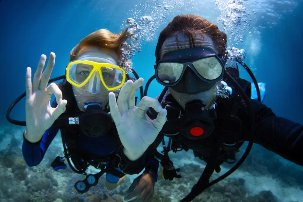 Scuba diving exploring wrecks and coral reefs