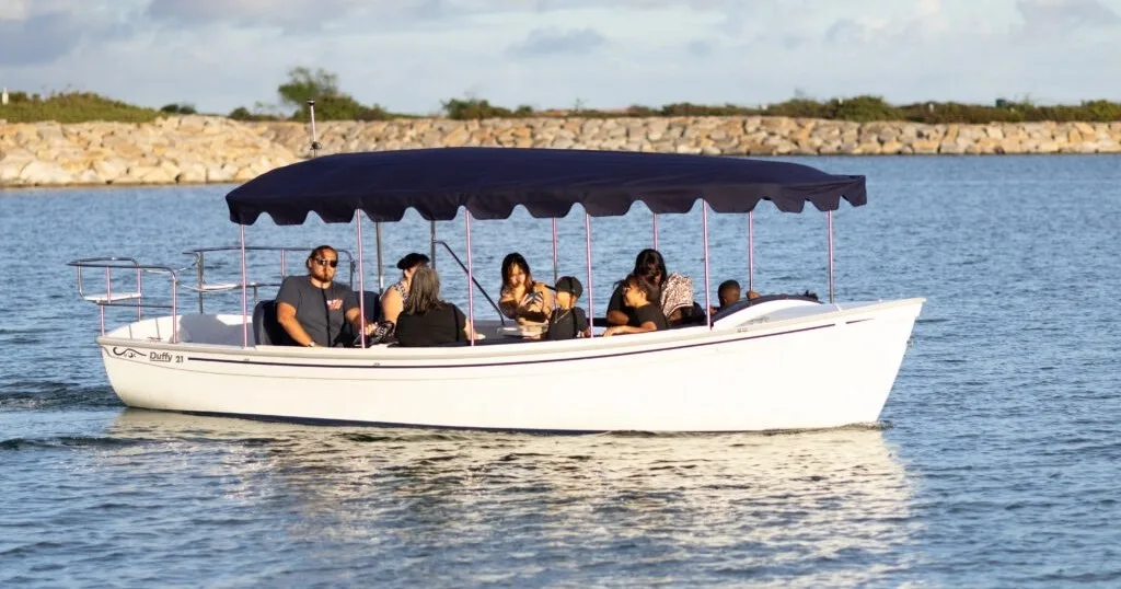 Duffy boat cruise offering peaceful sunset views on water