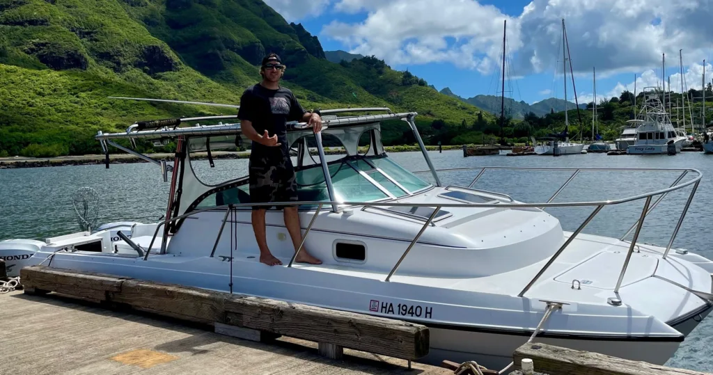 Private charter boat sailing near Kauai shore