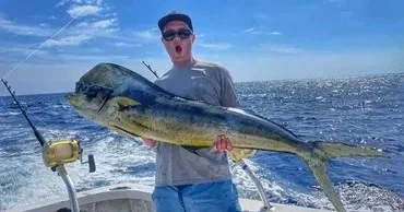 Fishing boat Innovator cruising during sunset hours