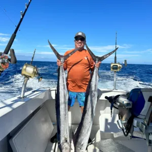 Fishing boat sailing on calm ocean waters at sunrise