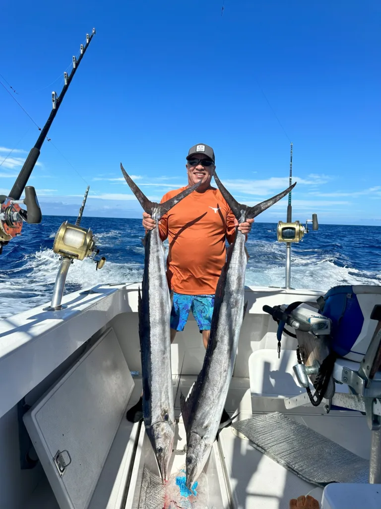 Fishing boat sailing on calm ocean waters at sunrise