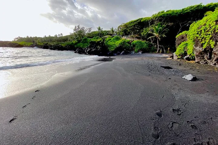 Tourists exploring Maui's stunning coastal landscapes by boat