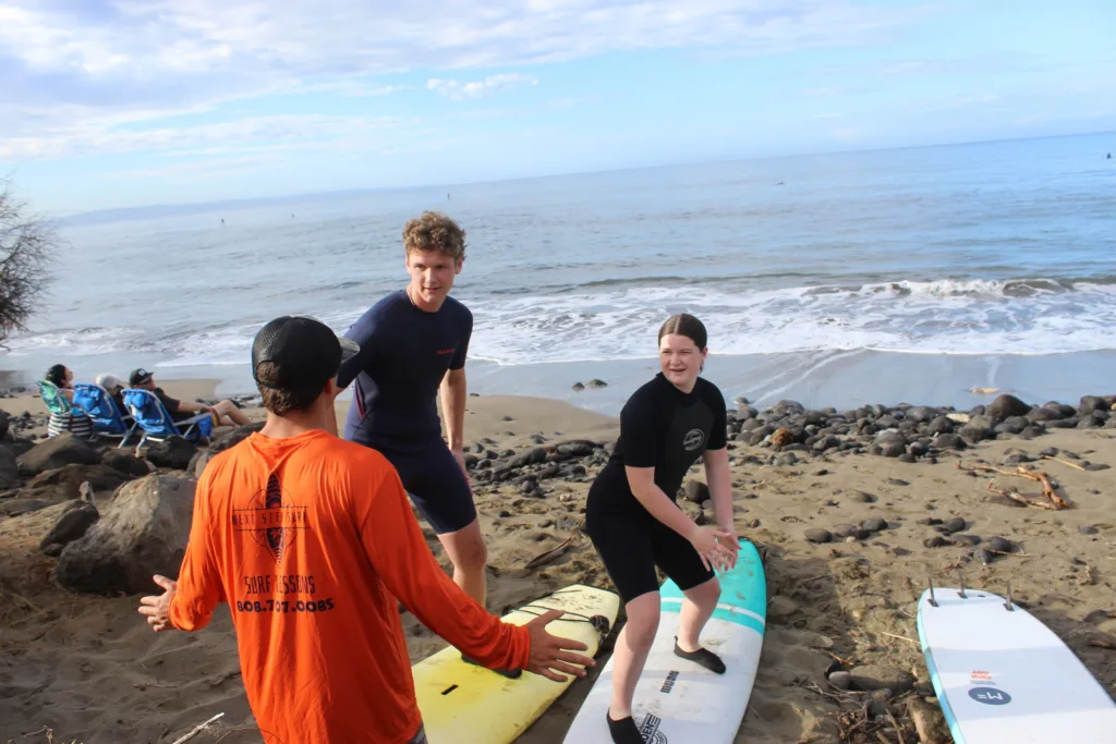 Advanced surfers catching waves on a sunny day