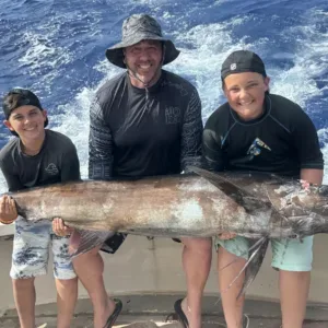 Fishing boat anchored offshore for half-day private fishing trip