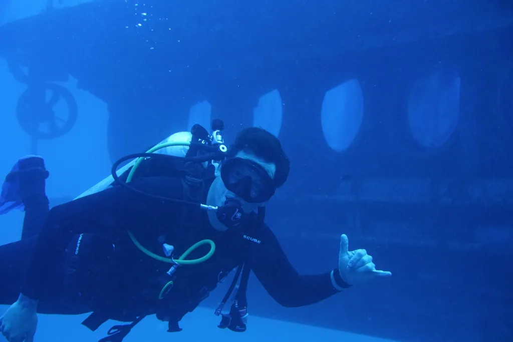 Submarine exploring underwater views near tropical island