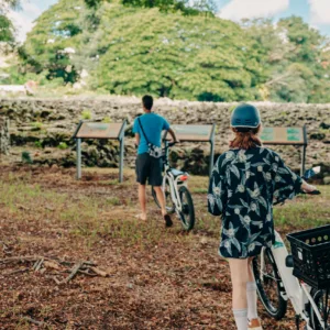 Cyclists riding e-bikes along scenic trails in Kailua on a food tour