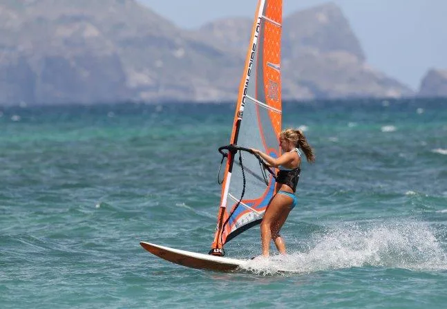 Windsurfers catching wind on island waters during course