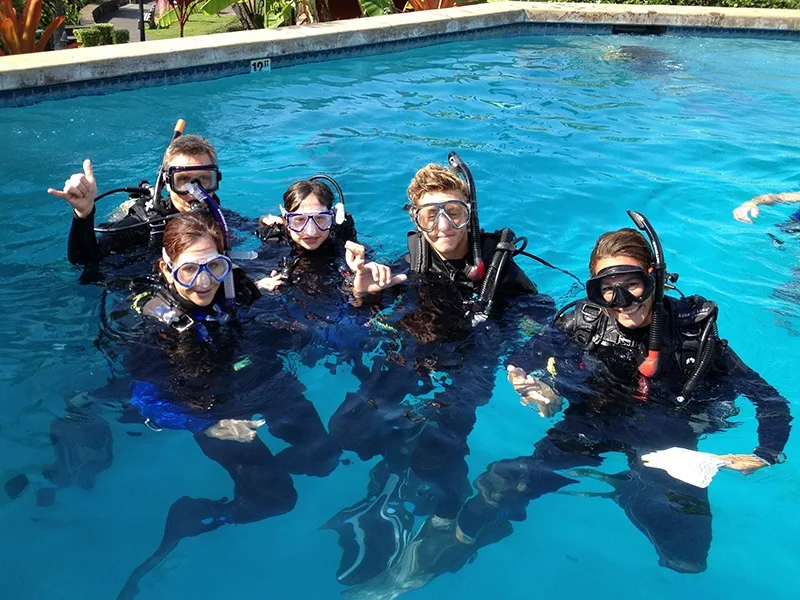 Scuba students practicing pool skills during refresher course