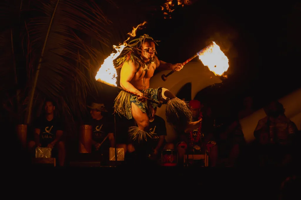 Guests enjoying a traditional Hawaiian luau experience
