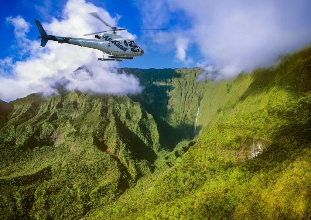 Family enjoying doors-on helicopter tour over Kauai island