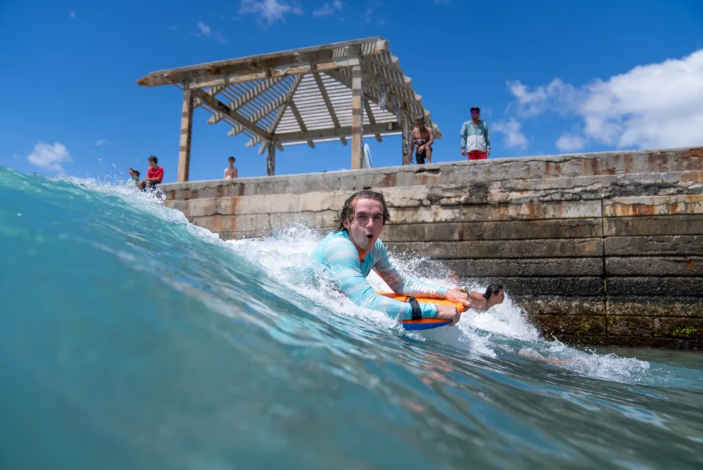 Private bodyboard lesson on a scenic island beach