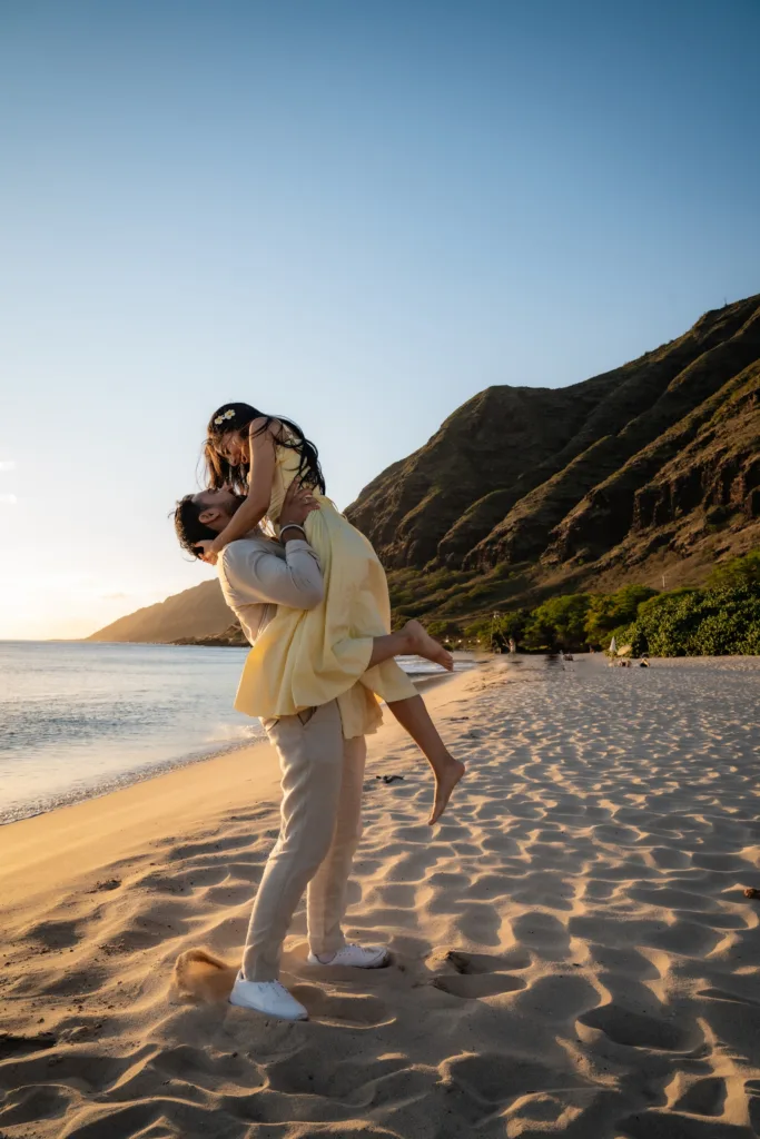 Couple posing for engagement photos in Oahu