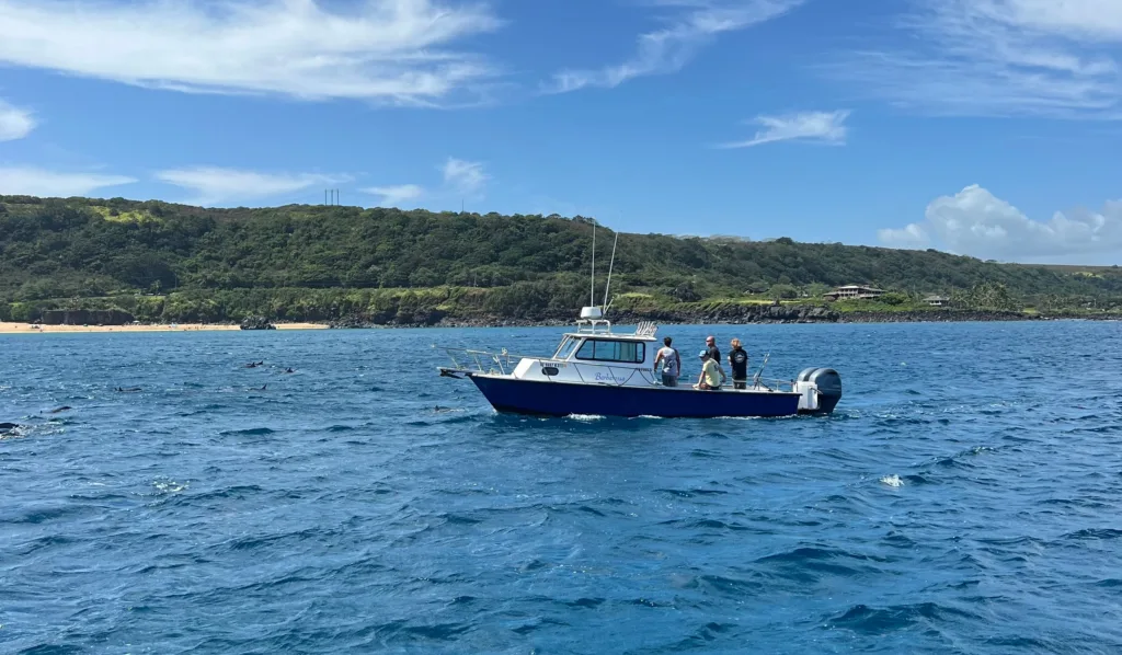 Private fishing boat cruising on calm ocean waters