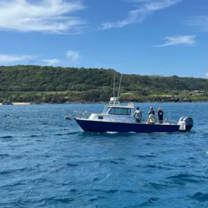 Private fishing boat cruising on calm ocean waters
