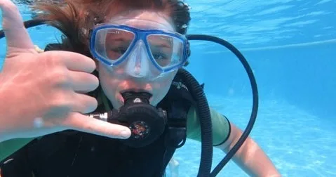 Beginner enjoying underwater views on introductory scuba dive