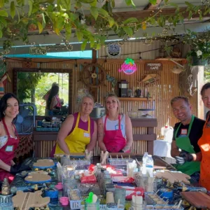 Artist creating ocean-themed resin art with vibrant colors