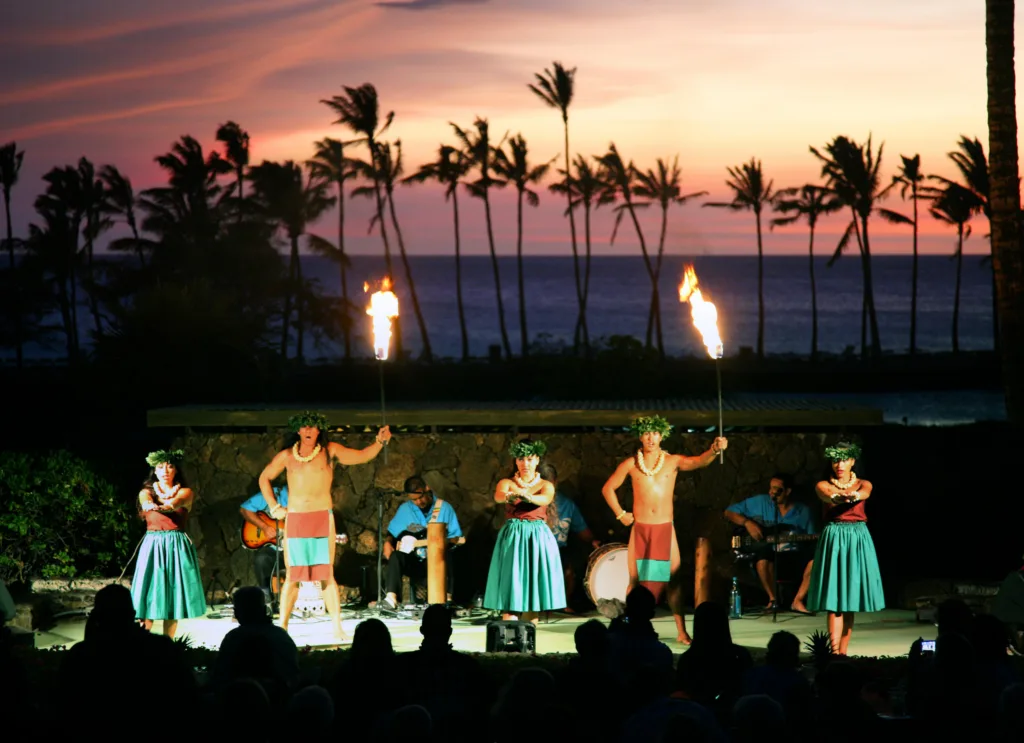 Guests seated enjoying an authentic Hawaiian luau