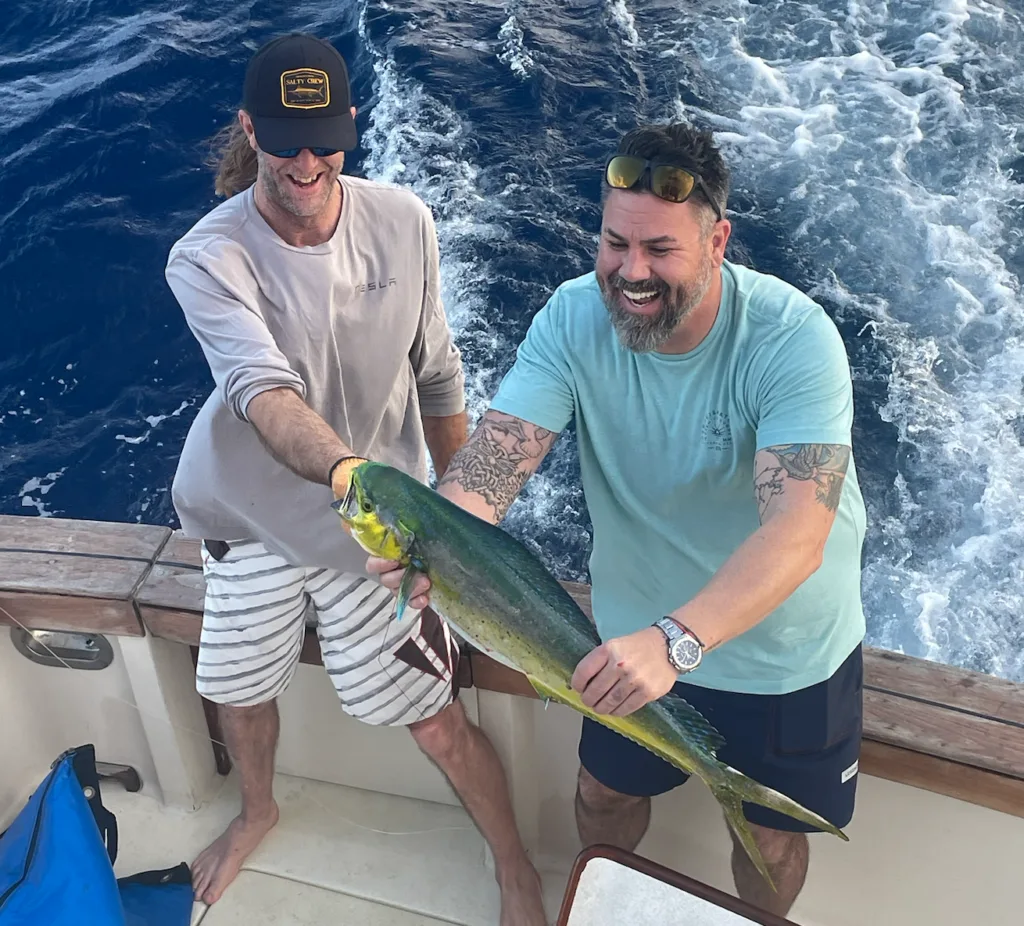Anglers catching fish on a deep sea boat