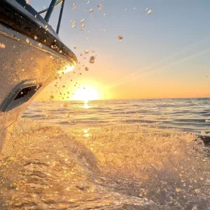 Person editing video footage on a laptop