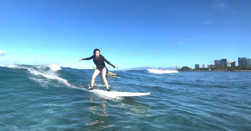 Add professional videographer to capture surf lesson moments