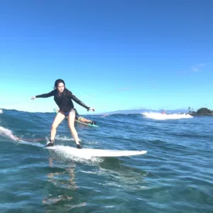 Add professional videographer to capture surf lesson moments