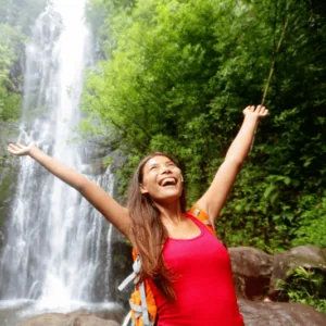 Luxury private tour vehicle driving along Road to Hana coastline