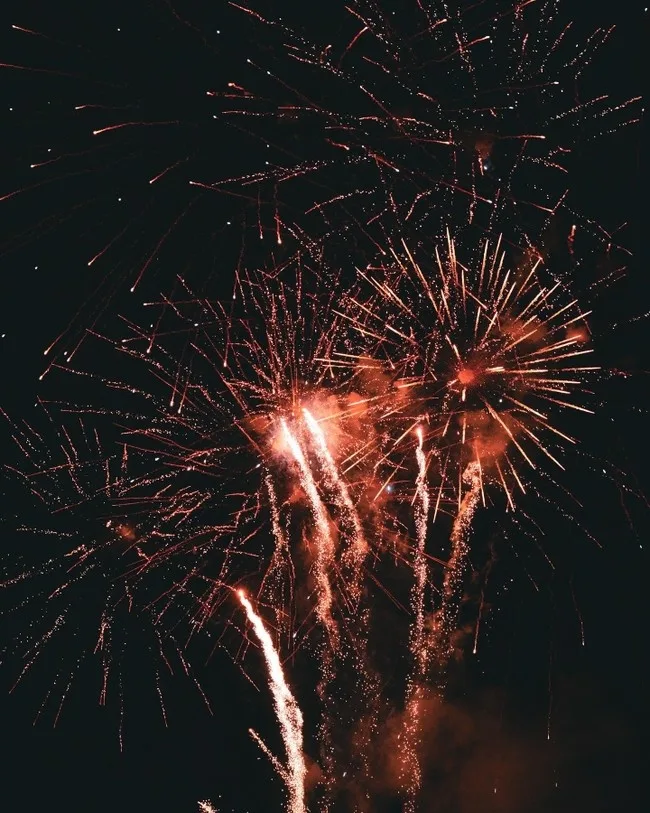 Fireworks lighting up sky over Waikiki beach at night