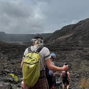 Hikers exploring lava tube formations near Kilauea Iki crater