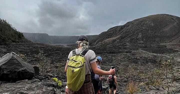 Hikers exploring lava tube formations near Kilauea Iki crater