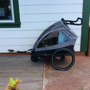 Electric bike trailer carrying supplies on scenic trail