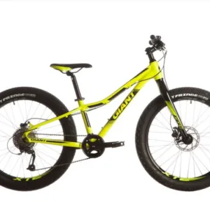 Child riding a Giant XTC 24 inch mountain bike outdoors